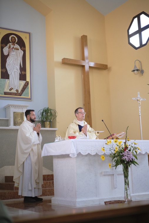 Priests celebrating Mass at the altar
