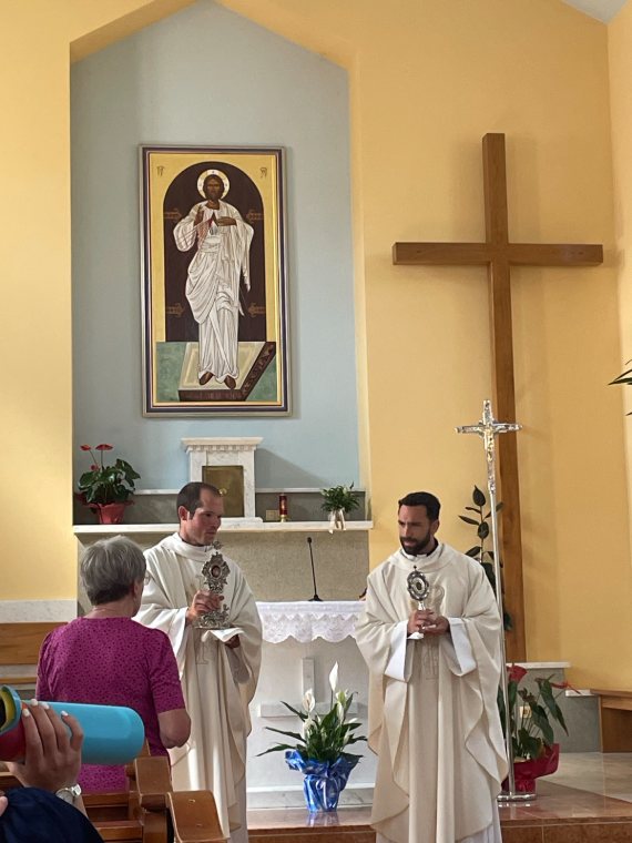 Two priests celebrating Mass in a chapel