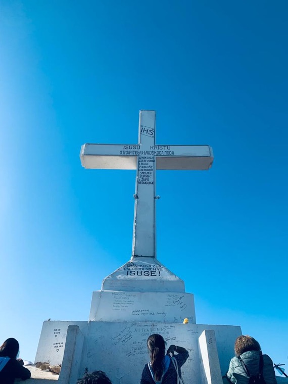 The white cross on Cross Mountain against a blue sky