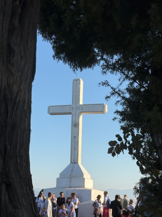 The cross on Cross Mountain seen through the trees