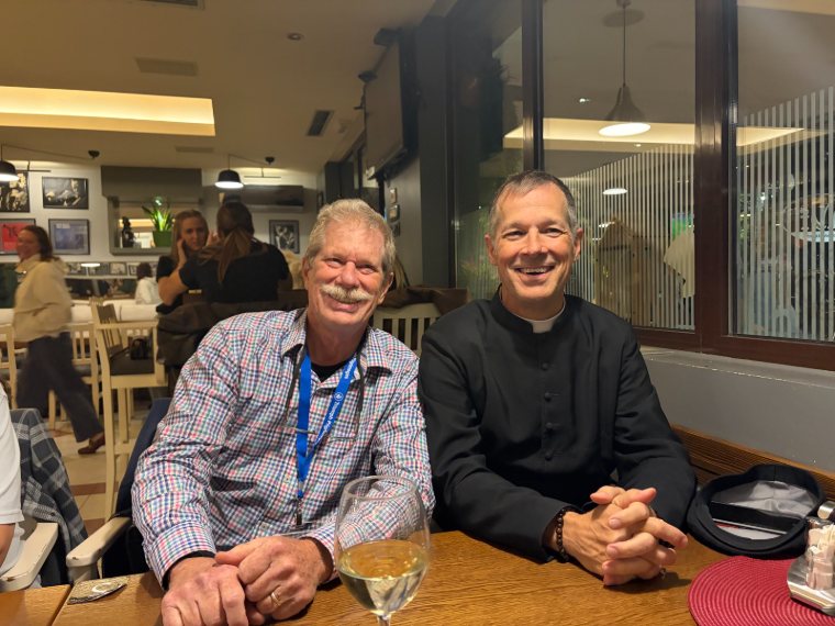 A pilgrim and a priest at dinner
