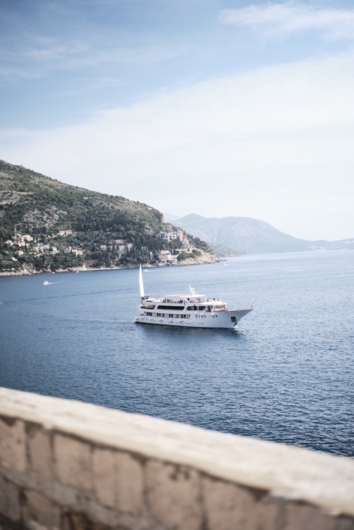 A ship along the coast, seen from the walls