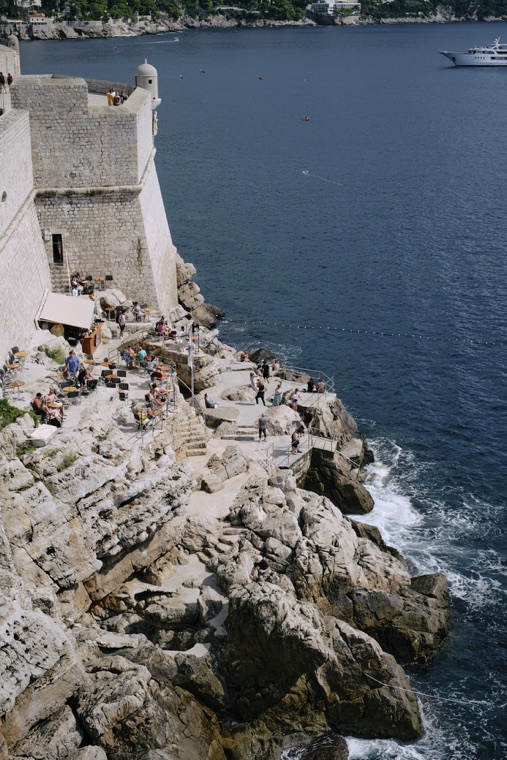 The city walls above the rocks and sea