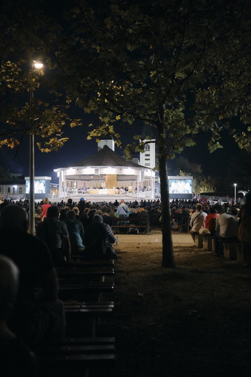 Evening prayer at the outdoor altar, under the trees