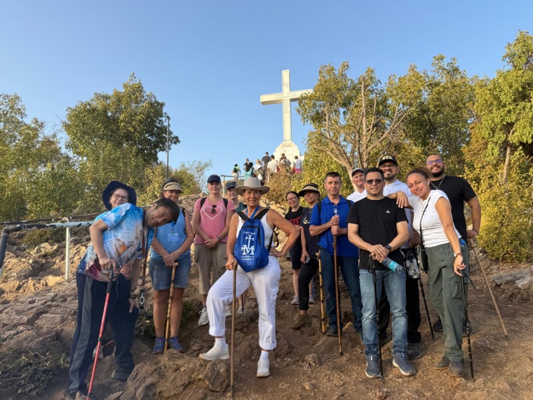 A Triumph group below the cross, summer 2026