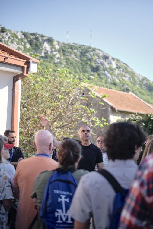 The group gathered in the street before the climb