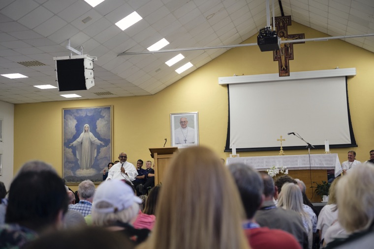 Pilgrims gathered for a talk in the hall