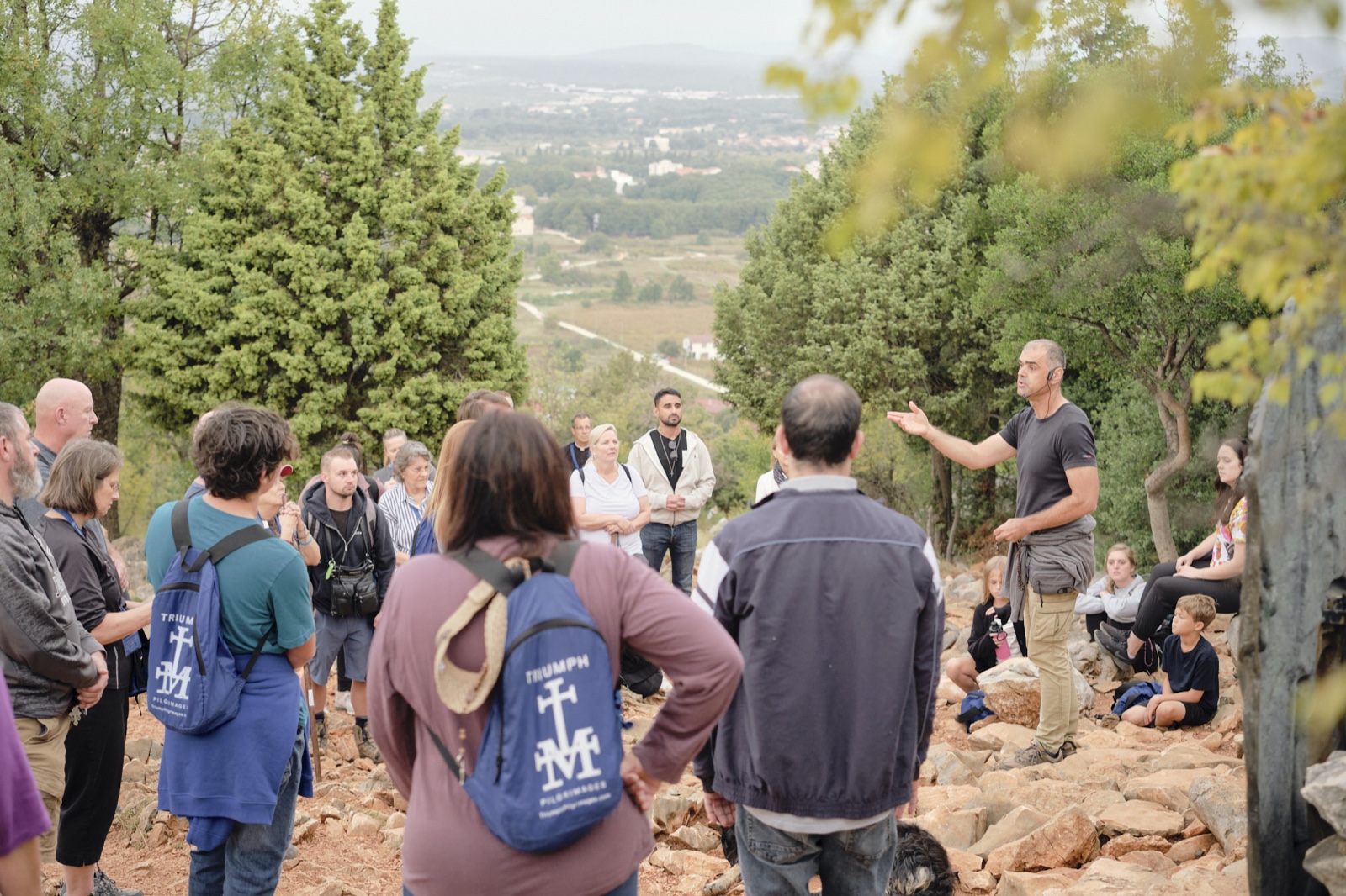 The group listening to a talk on the hillside